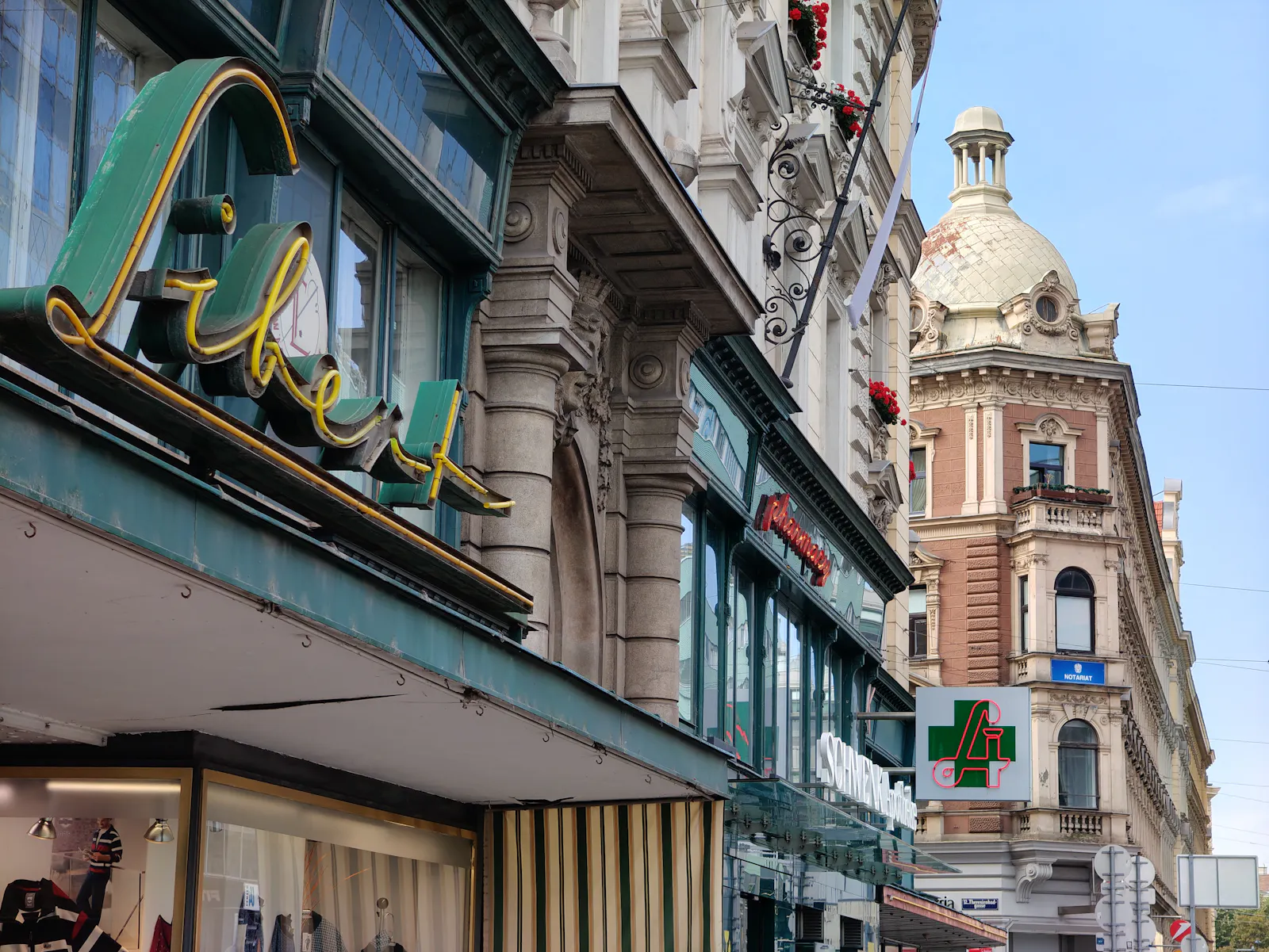 Ornate facades and shop signs along Schönbrunner Straße, opposite of U4 Meidling Hauptstraße underground exit | Schönbrunner Straße 257, 1120 Wien