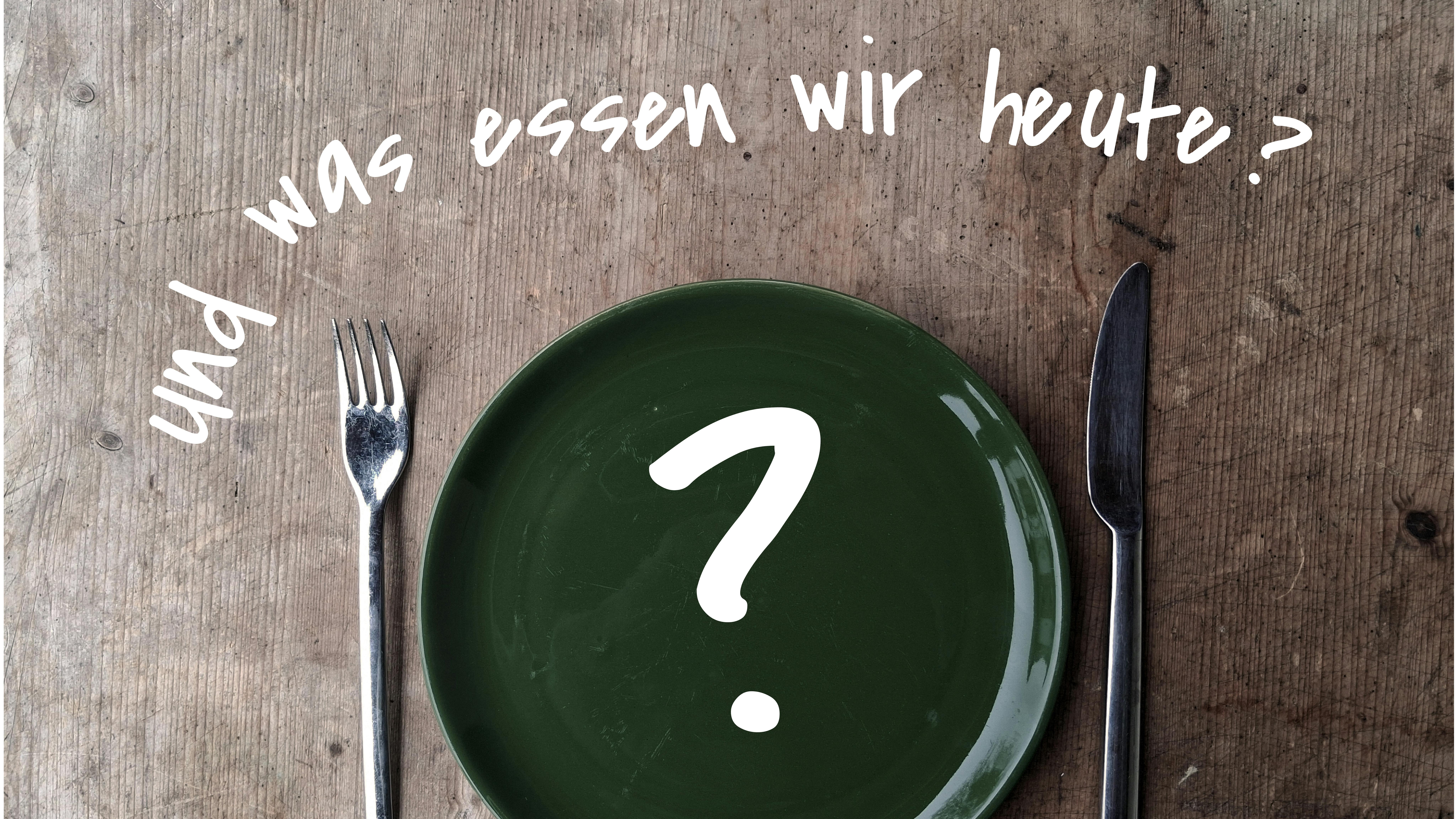 Ein Tisch mit leerem Teller, Besteck und der Frage: "Und was essen wir heute?"