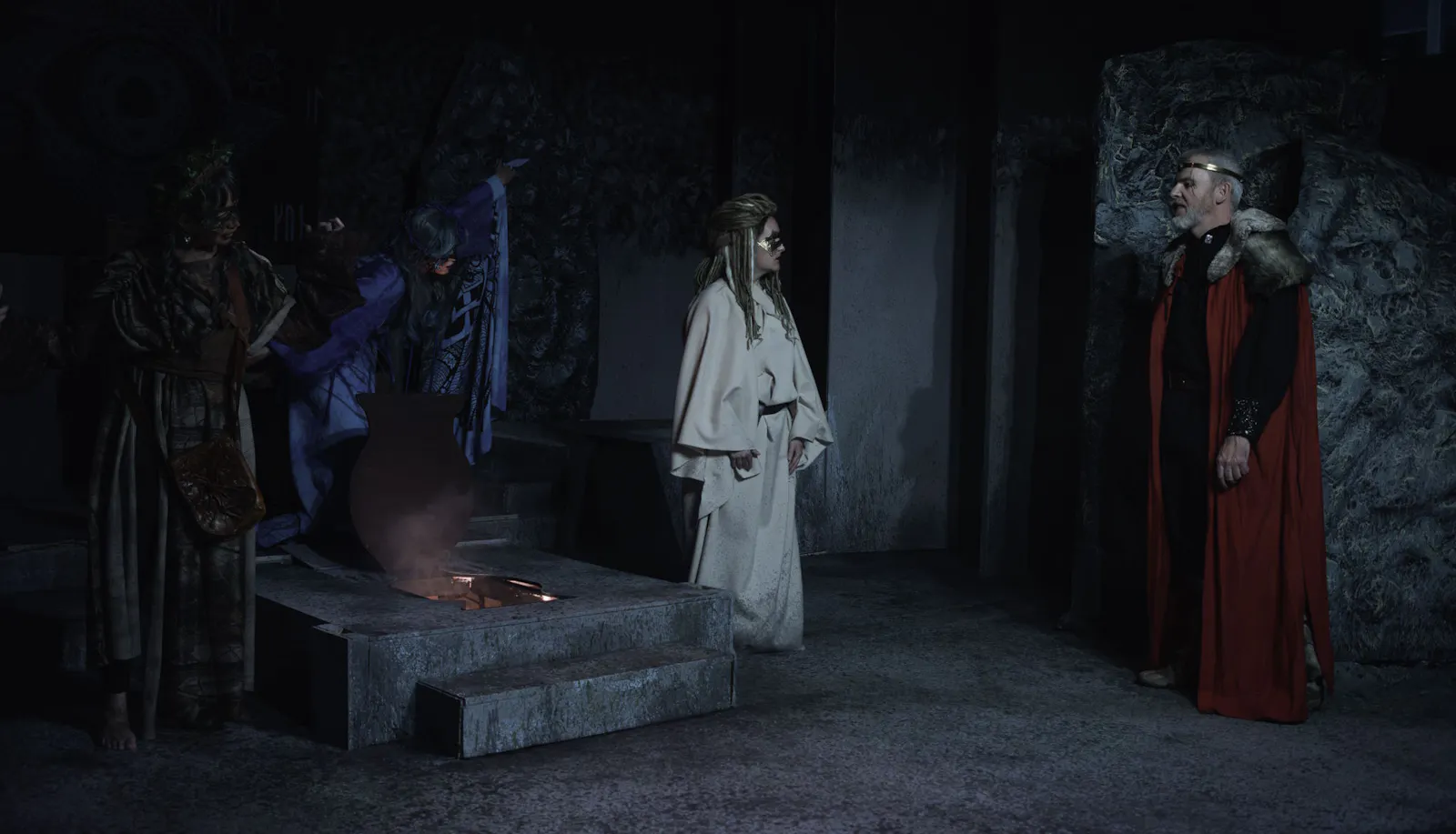 Macbeth encounters the three witches in a production by The Archway Theatre, Horley.