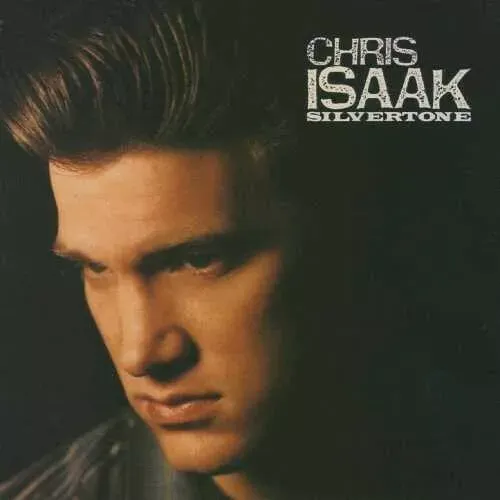 Cover-Artwork des Albums "Silvertone" von Chris Isaak. Stimmungsvolles Porträt-Foto des Künstlers im Halbprofil