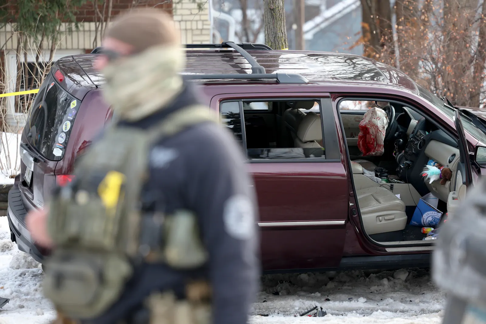 We see through the open passenger door into Good’s SUV. The glove compartment is overflowing with toys and stuffies. But next to it, the deployed airbag is drenched in blood.