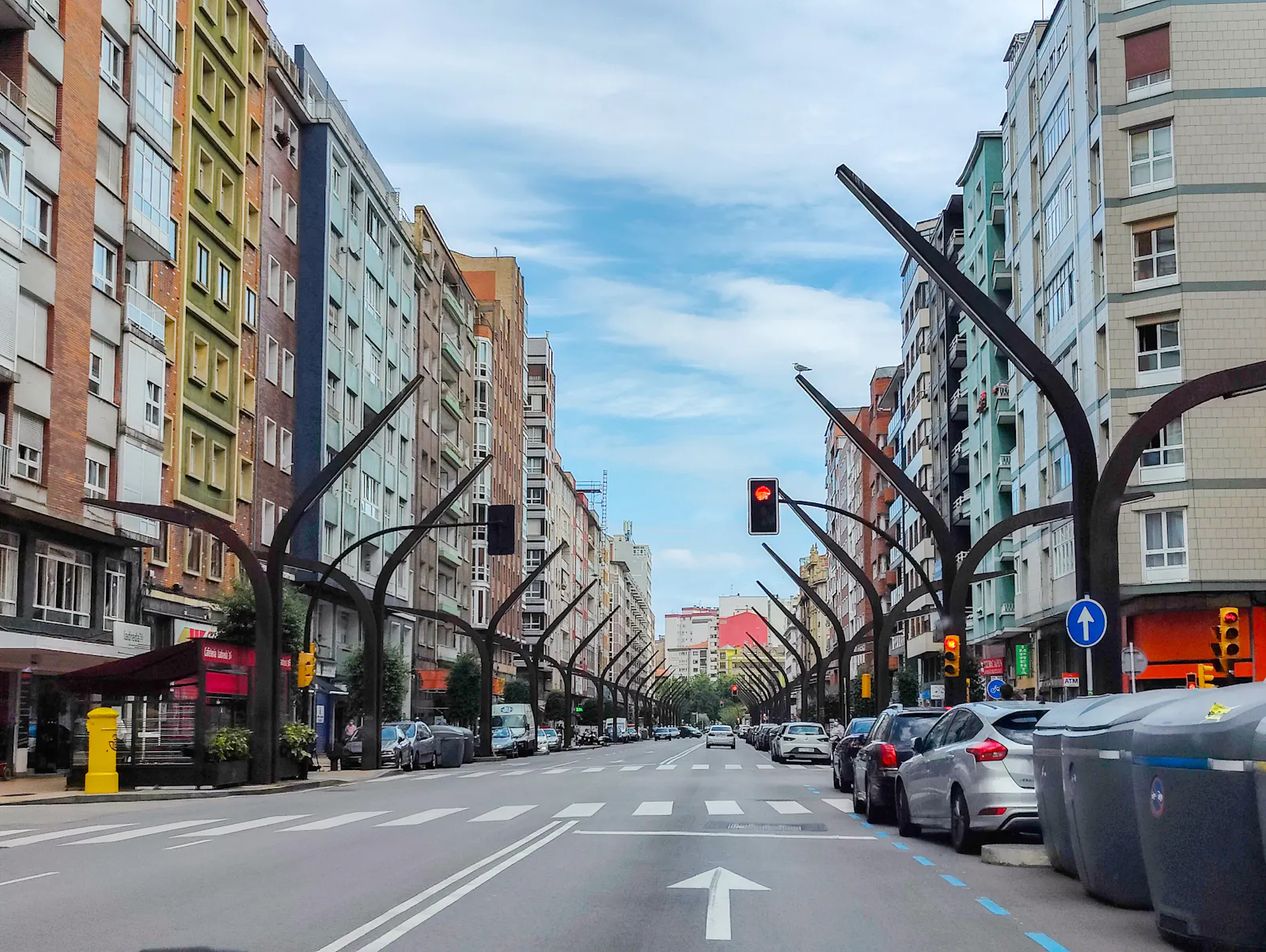 Entering the city via Avenida de la Constitución lined with modern residential blocks and its characteristic tree-shaped streetlights | Avenida de la Constitución 44, 33207 Gijón/Xixón