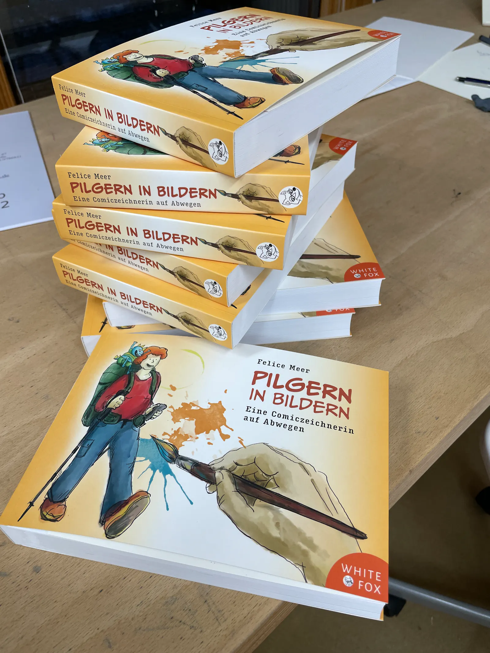 Bücherstapel Pilgern in Bildern