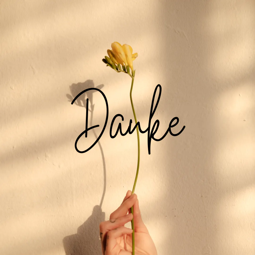 Mit einer gelben Blume Danke sagen