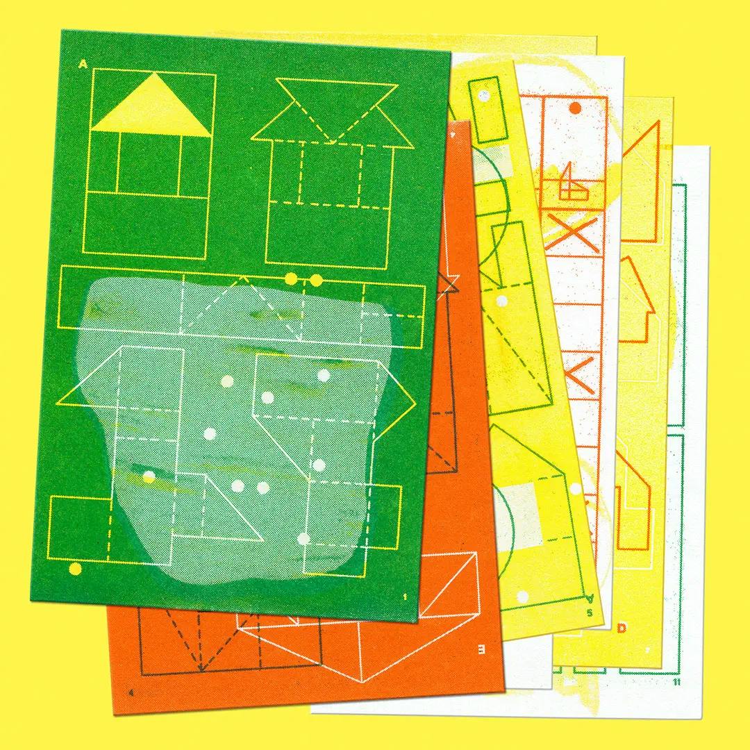 Stack of colorful cards with geometric shapes and dotted lines resembling paper craft templates