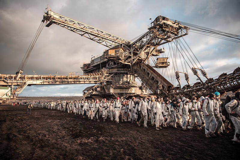 EG mass action
digger and activists in a open pit mine