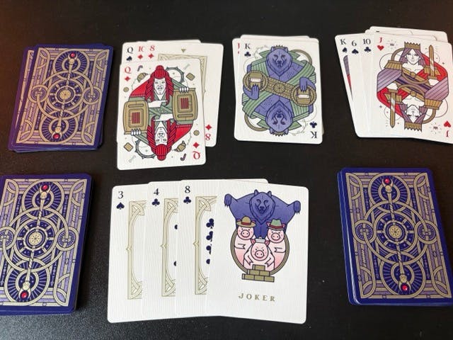 Playing cards arranged to play A Royal Dinner