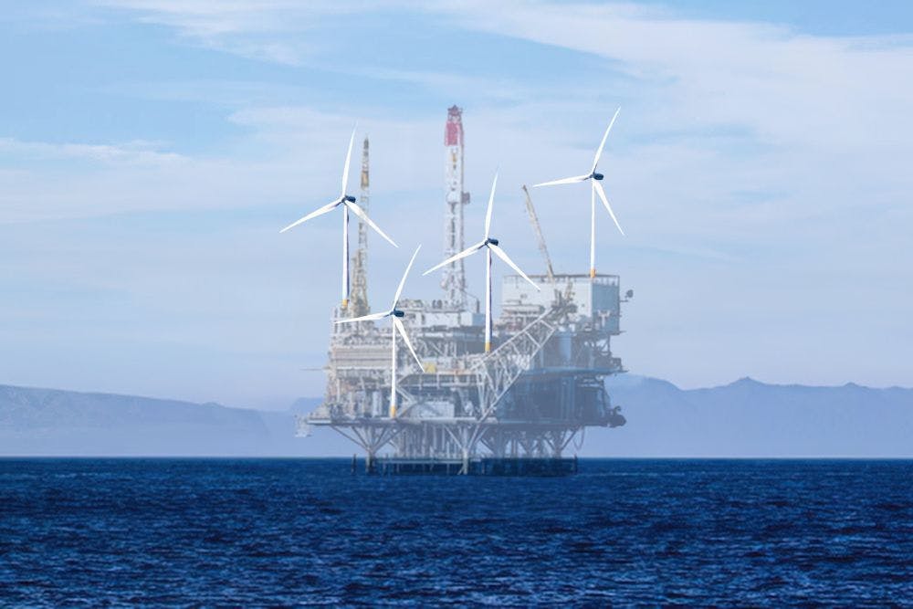 Une plate-forme pétrolière en mer est en train de disparaître, et de nouvelles éoliennes ont été installées sur ses fondations.