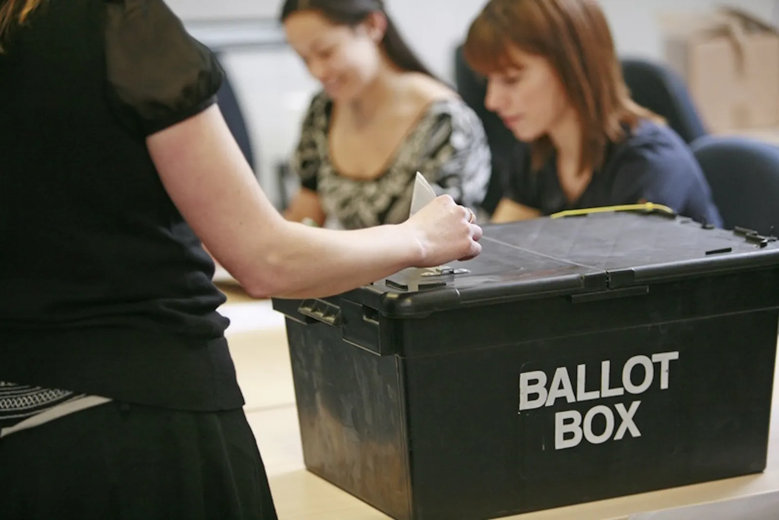 A woman using a ballot box to vote (credit: Electoral Commission)