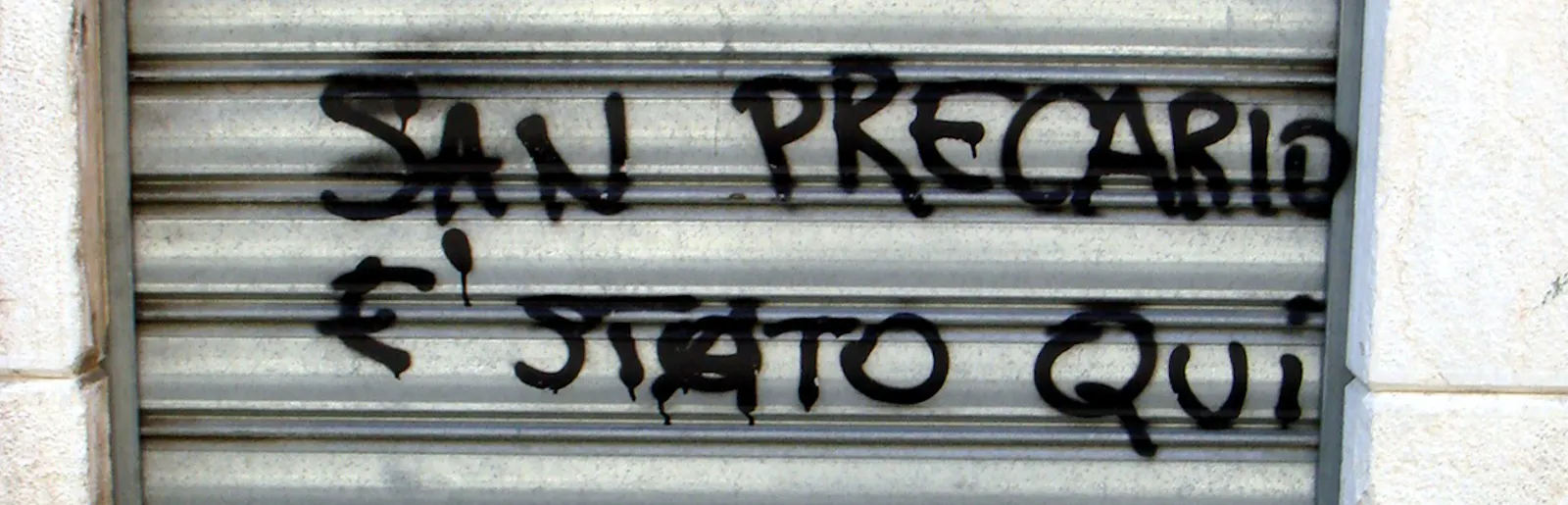 Graffiti auf Italienisch, "San Precario é stato qui"