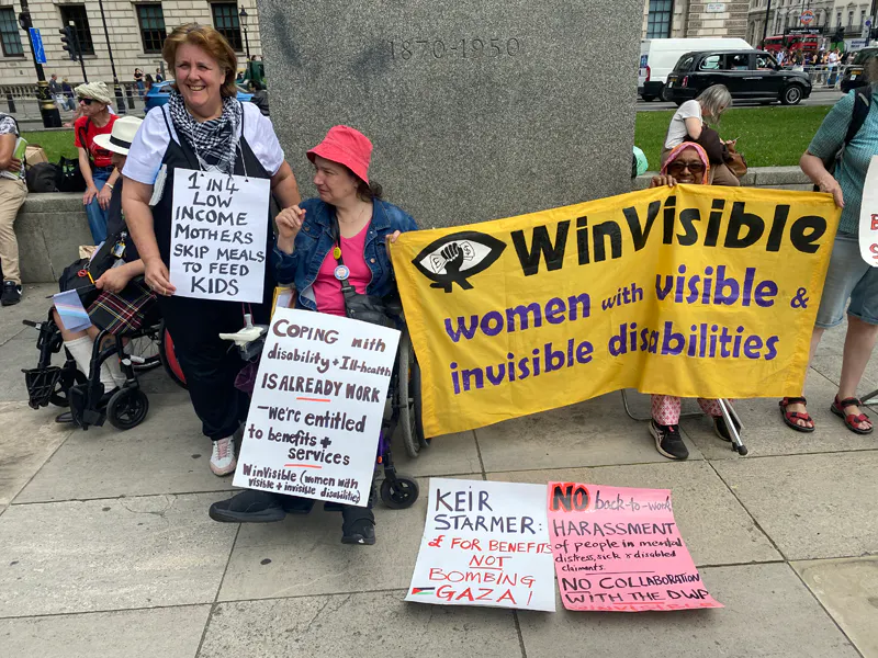 Disability campaigners outside the Houses of Parliament in London