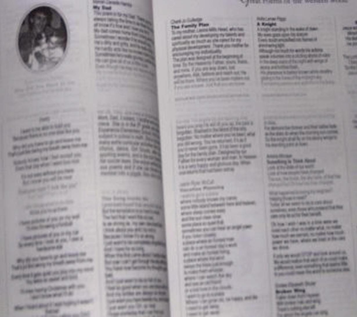 A photograph of the book's interior pages showing half printed poems and large blank spots in the upper third of the page where the printer ran low on ink. Pure garbage.
