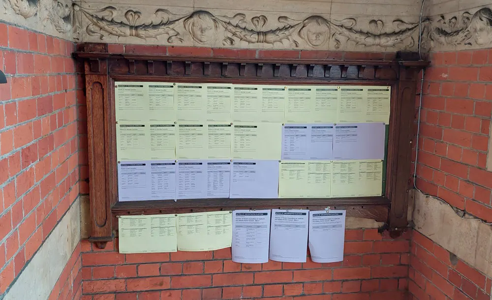 Election notices on display at the Town Hall, Castlefield Road, Reigate, for the May 2023 local elections