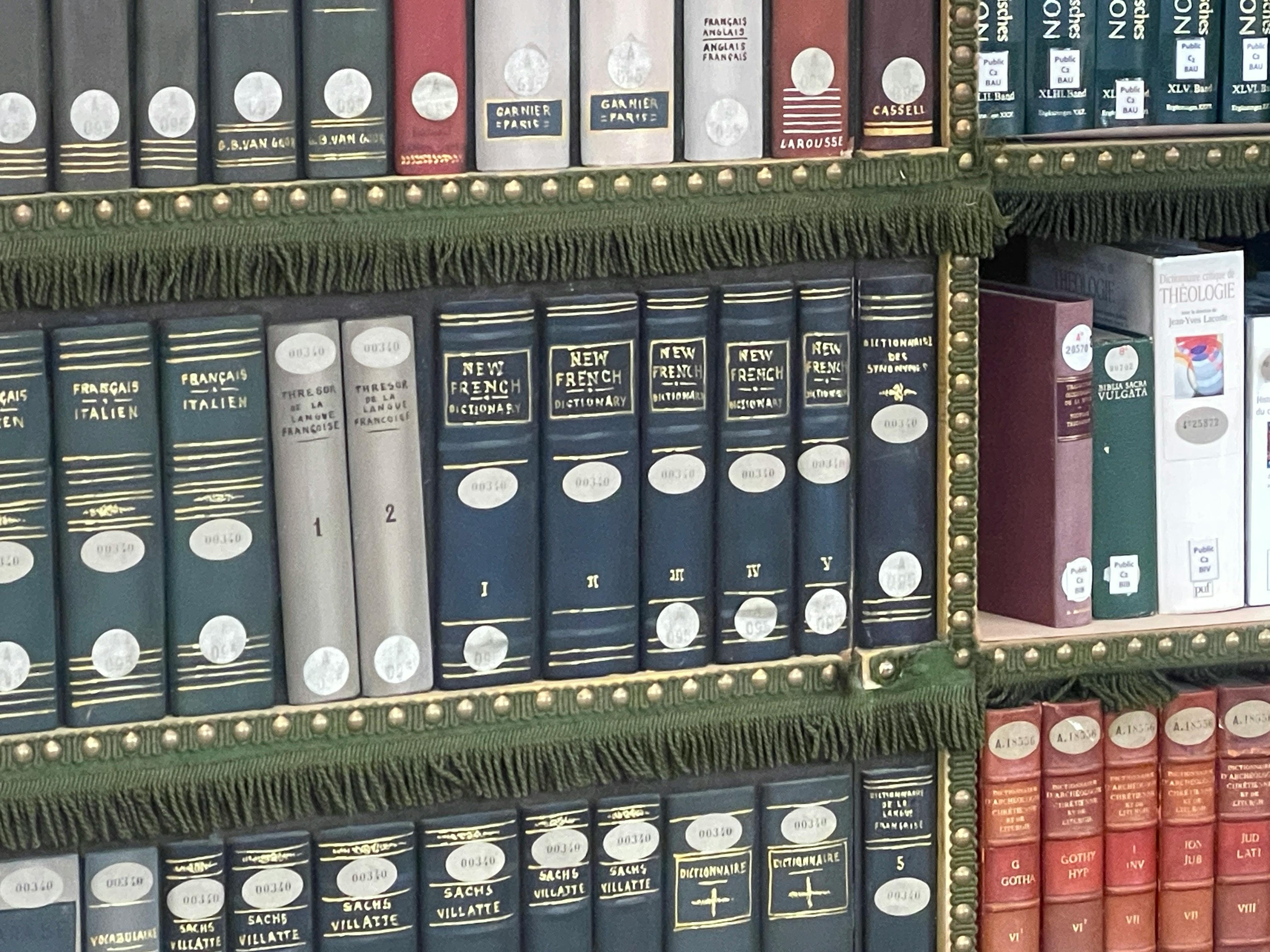 A closeup of a bookshelf at the Mazarine Library in Paris, France.