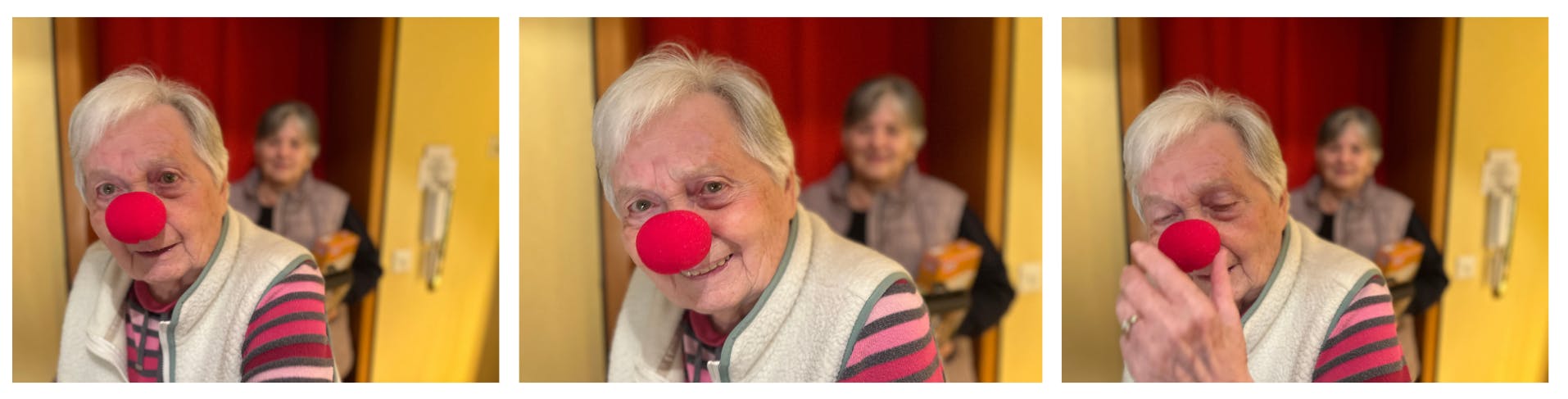 Emi mit Clownsnase und guter Selle im Hintergrund